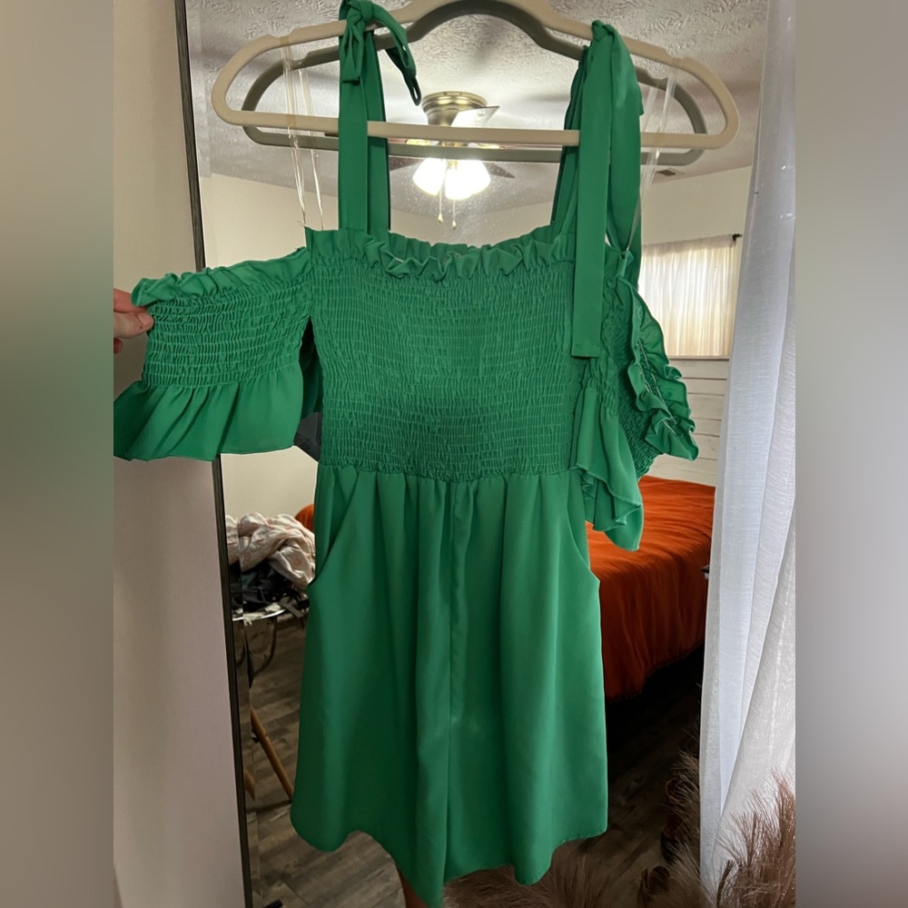 Green boutique romper with pockets. Size M.